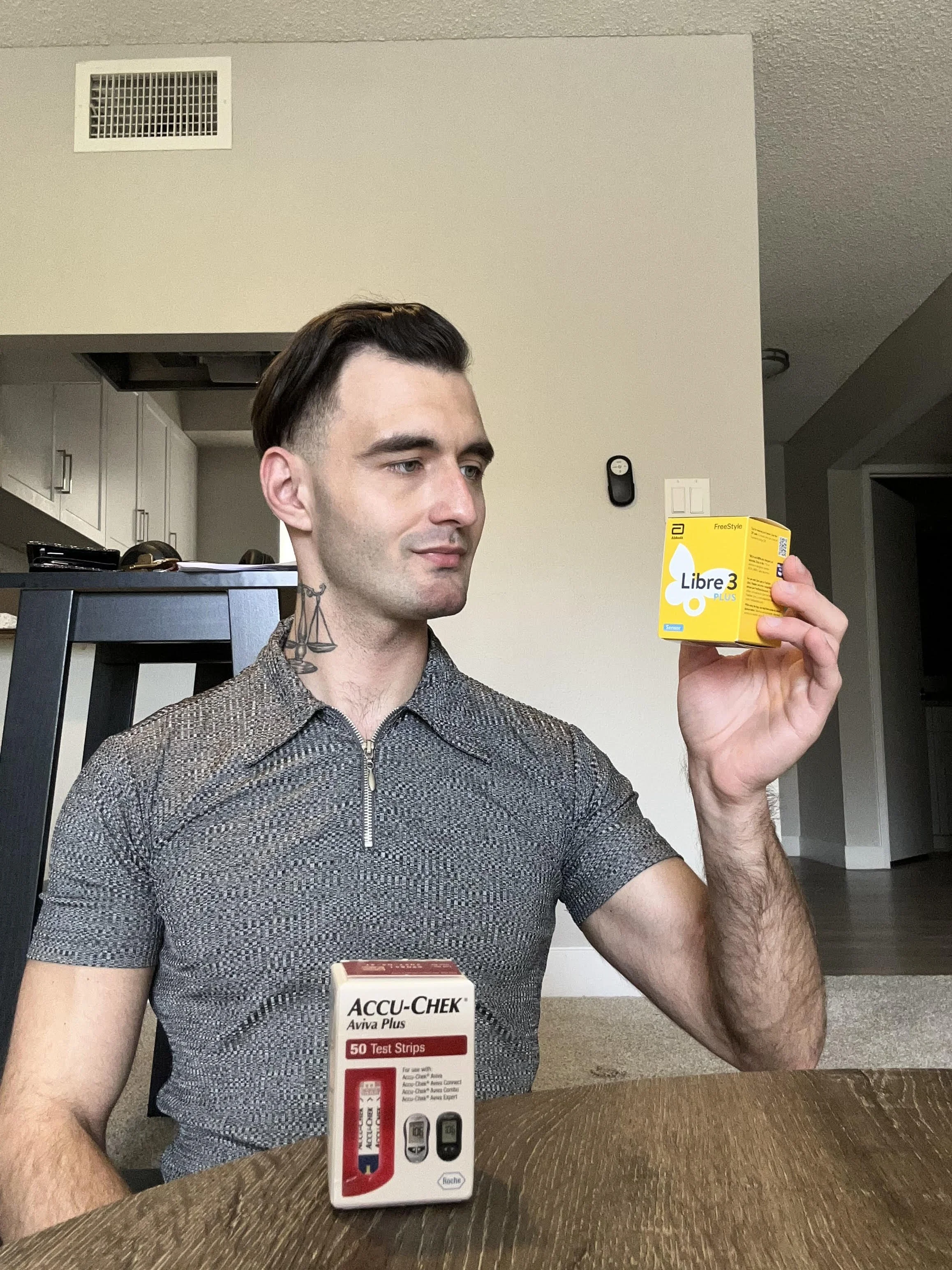 Person with Libre sensor and test strips