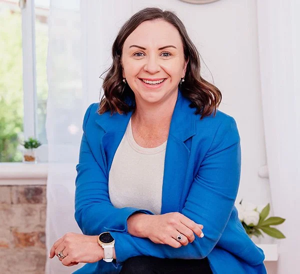 Emma Bowdler in a blue jacket, smiling