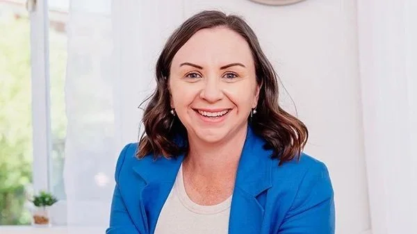 Emma Bowdler smiling in a blue blazer