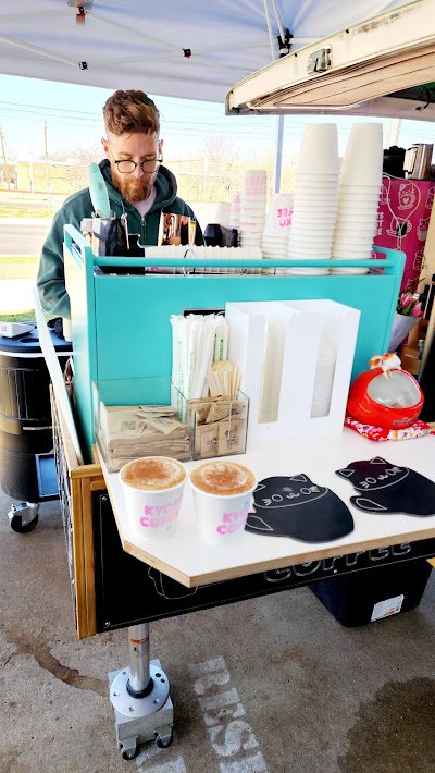 Patrick behind the espresso machine after making two drinks for customers in March of 2025