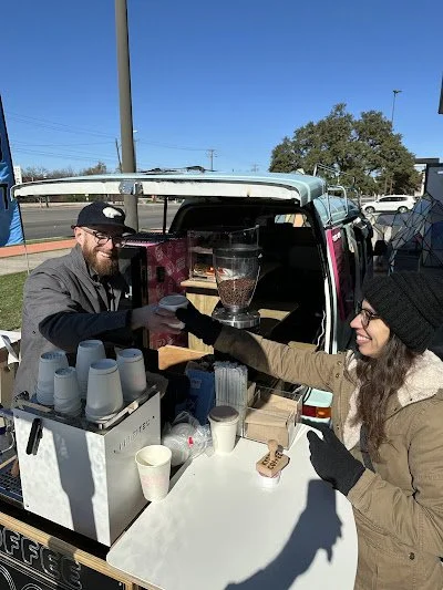 Patrick serving a customer at Kyoko Coffee van on opening day in Austin