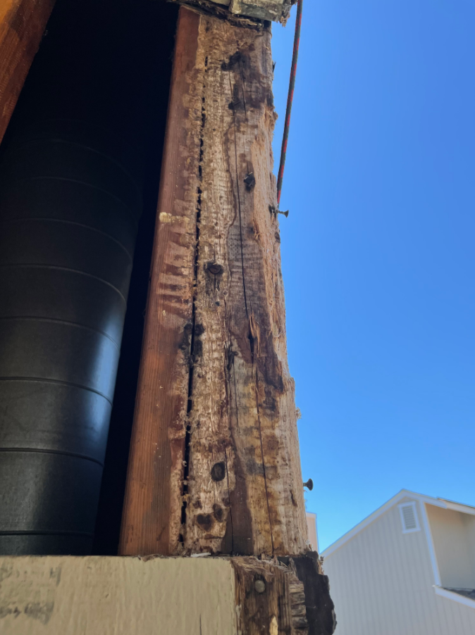 Repairing a rotted siding of a Martinez home.