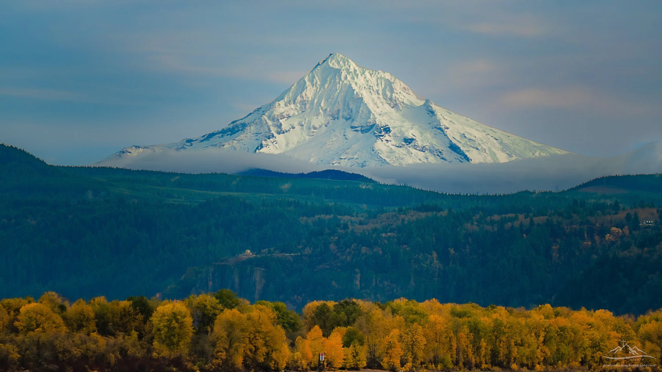 What a beautiful lady... the ever iconic Mt. Hood  of Oregon. Dressed in fresh white with the Fall colors below is a reminder of the contrast of seasons in their ever changing march through the days of the year. 