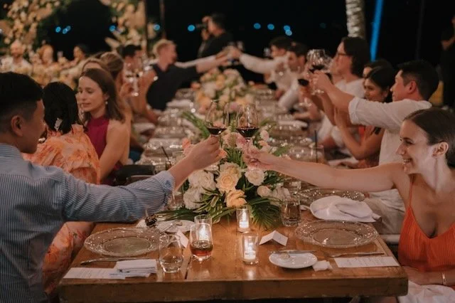 wedding guests raising a toast