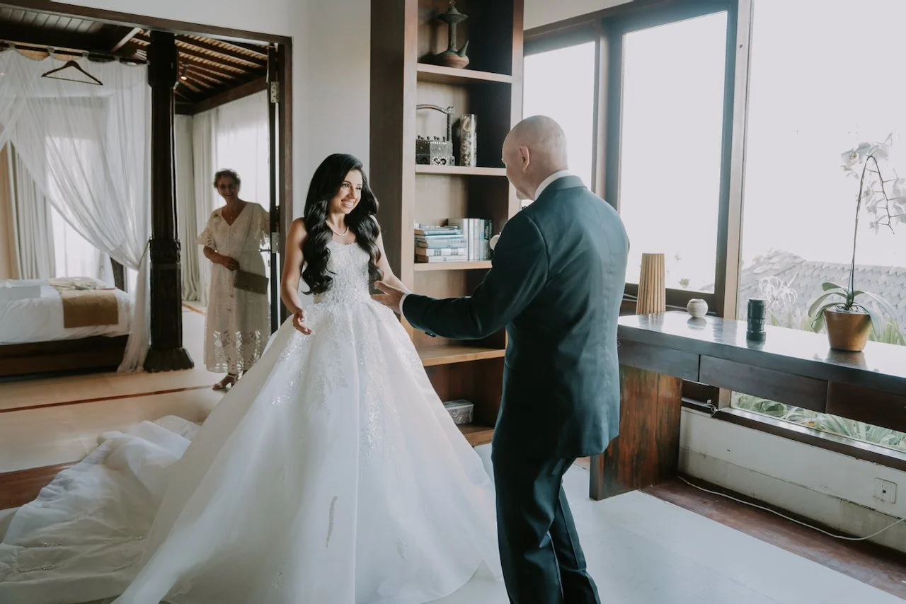 Bride Sophia sharing an emotional moment with her father before the ceremony at their Bali destination wedding
