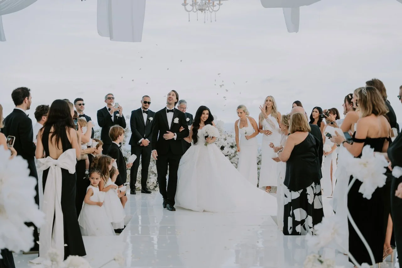 Joyful confetti moment as guests celebrate Sophia and Hamish’s wedding ceremony at The Surga Bali