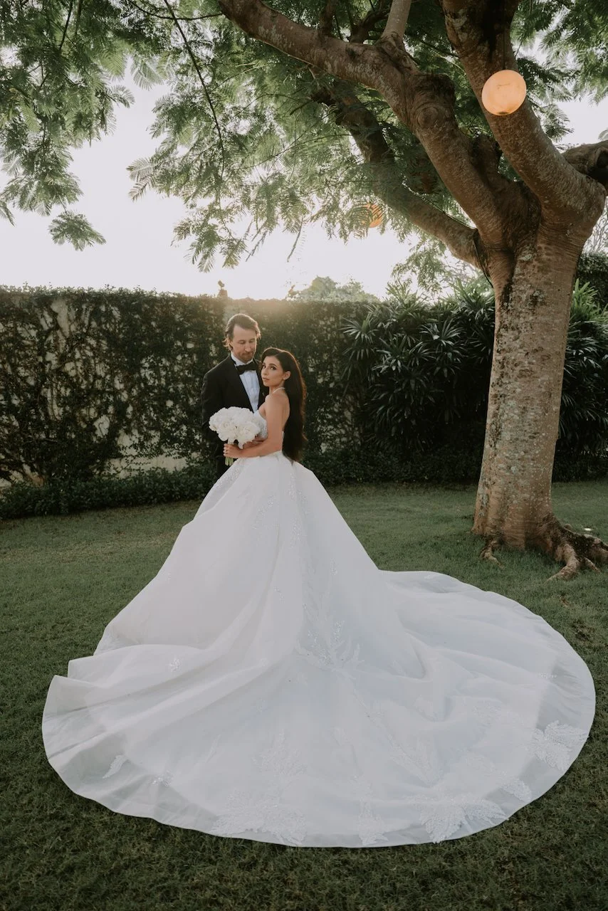 Romantic sunset portrait of the bride and groom in the gardens at The Surga Bali after their wedding ceremony