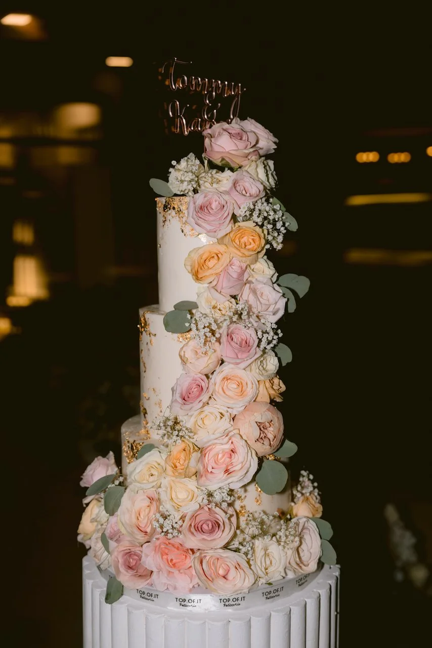 Floral wedding cake with blush roses at Surga Estate Bali reception