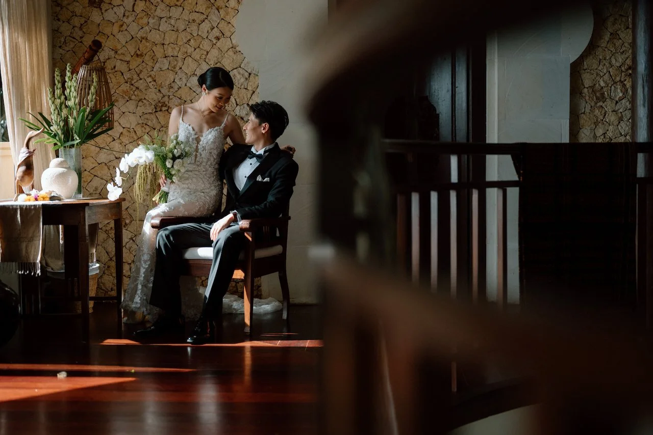 Bride and groom sharing a quiet embrace inside a luxury Bali villa.