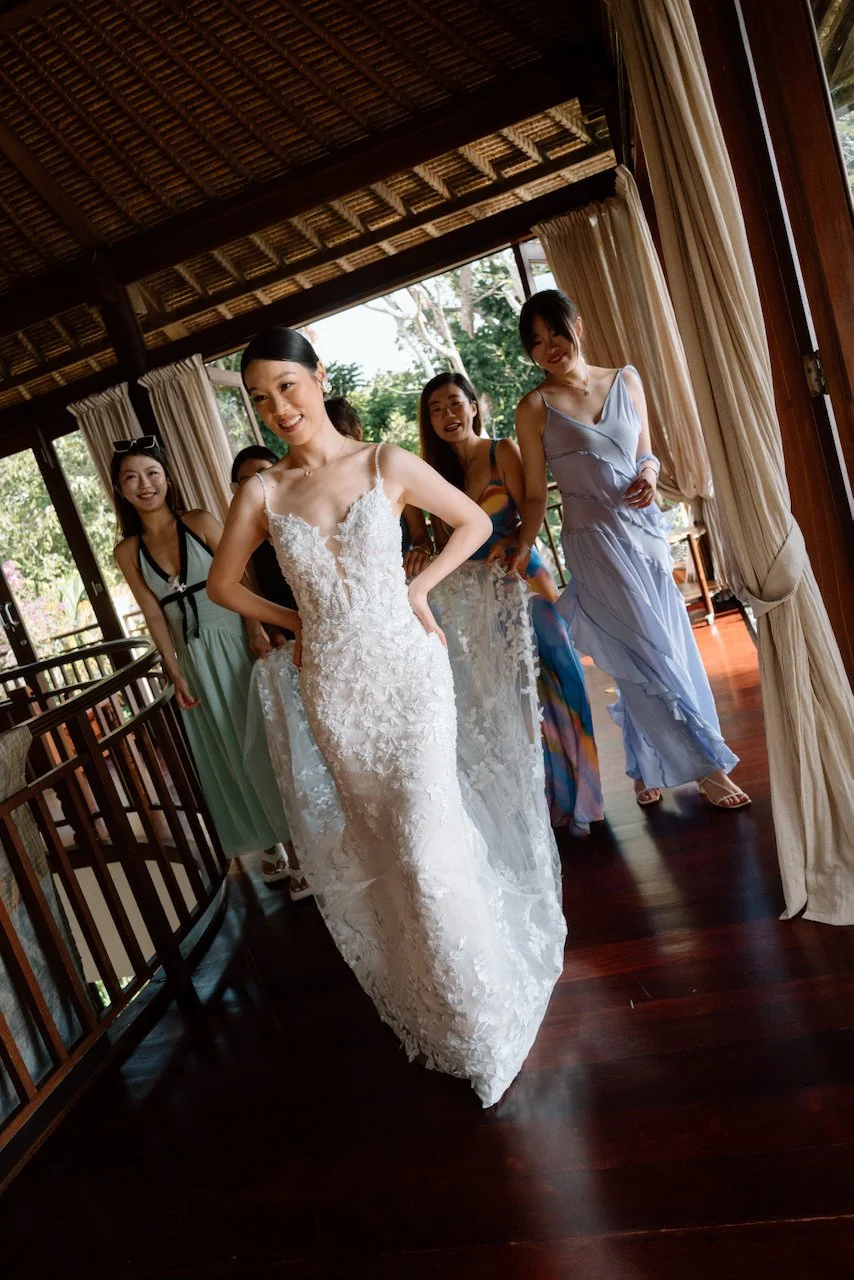 Bride walking with her bridesmaids before her Villa Pemutih wedding.