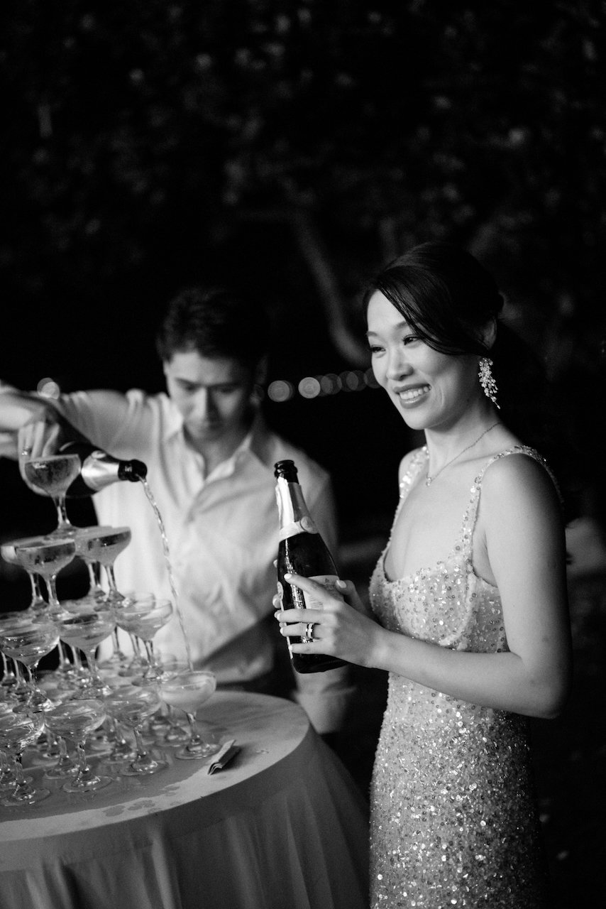 Black and white portrait of a champagne pour at a Silver Lace Weddings event.