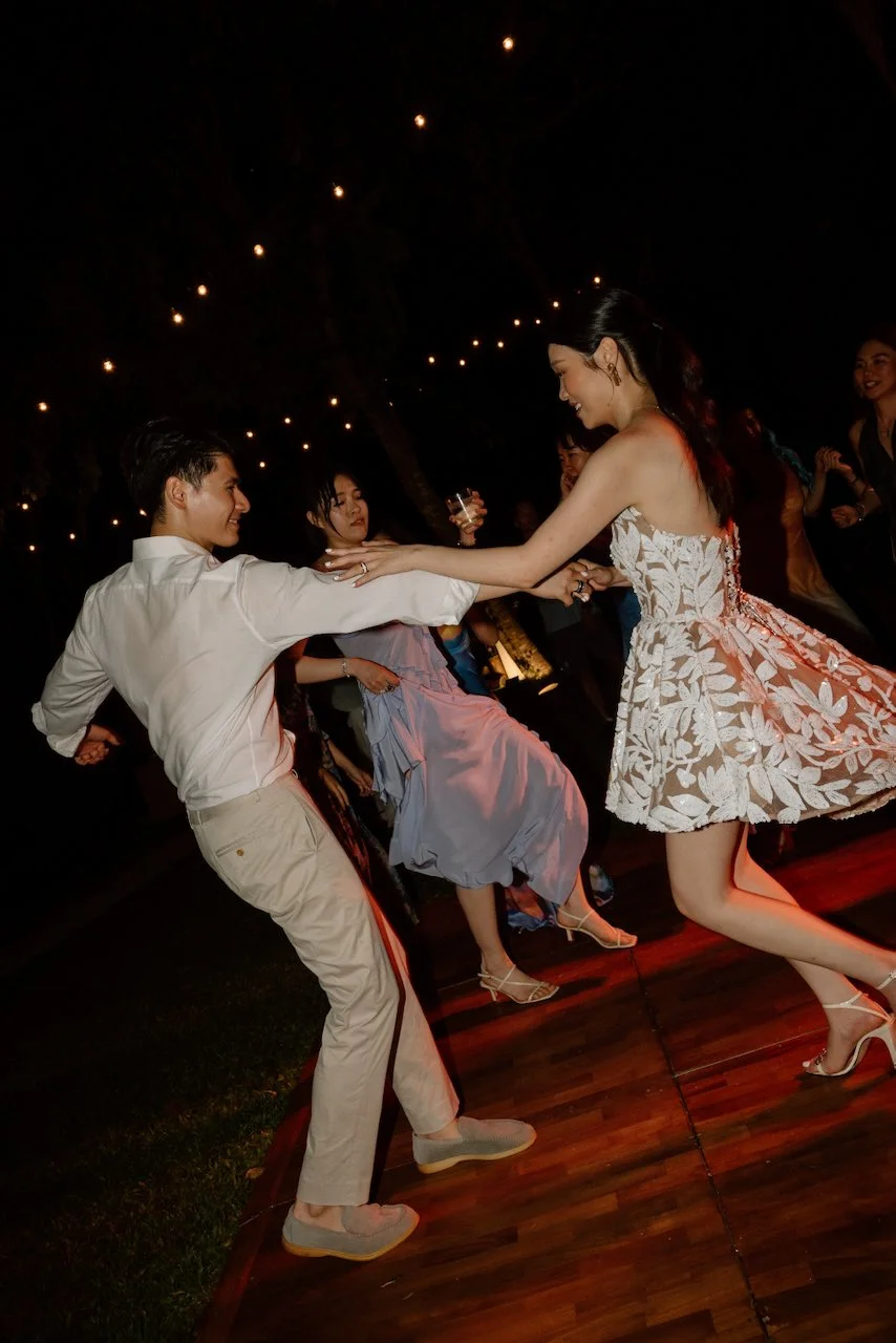 Couple dancing closely at their outdoor Villa Pemutih wedding celebration.