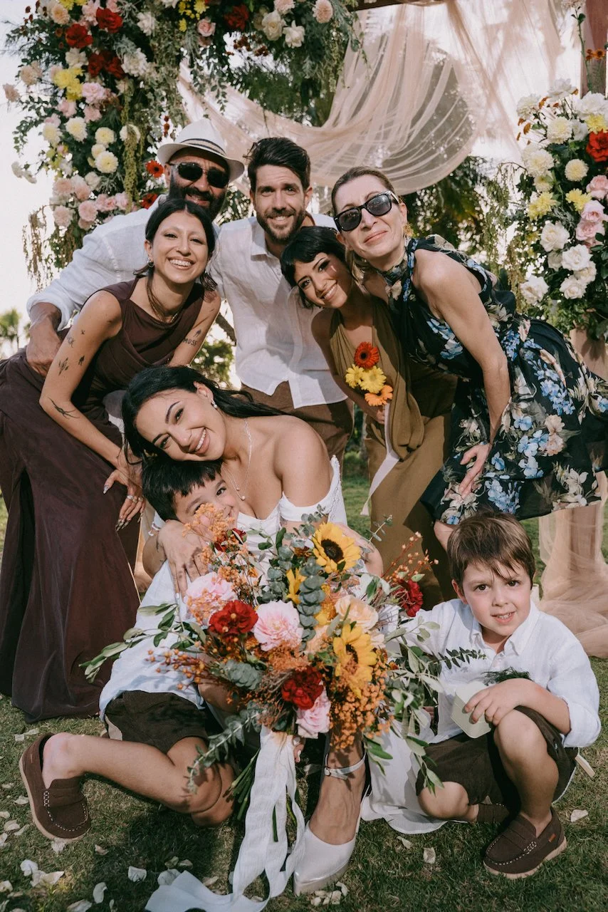 Family and friends celebrating with the newlyweds after the ceremony.