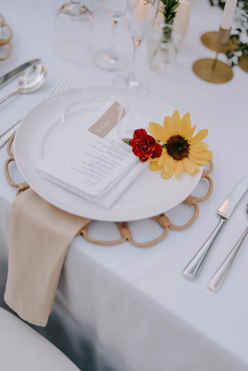 Wedding menu and place setting styled with colourful floral details.