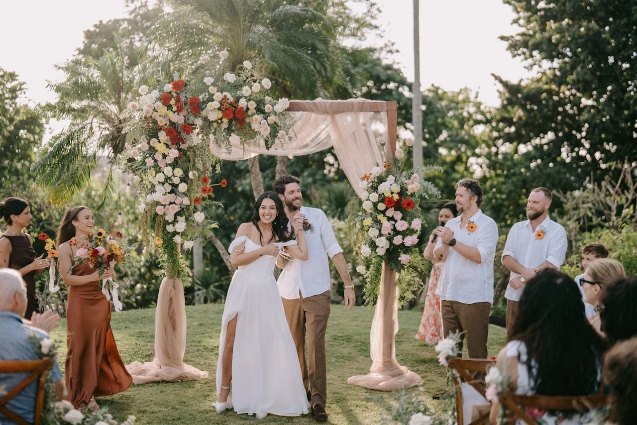 Emily and Tom celebrating their wedding ceremony at Peppers Seminyak.