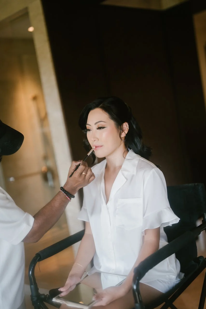 Bride Zoe having bridal makeup applied before her Bali wedding at Ayana Resort