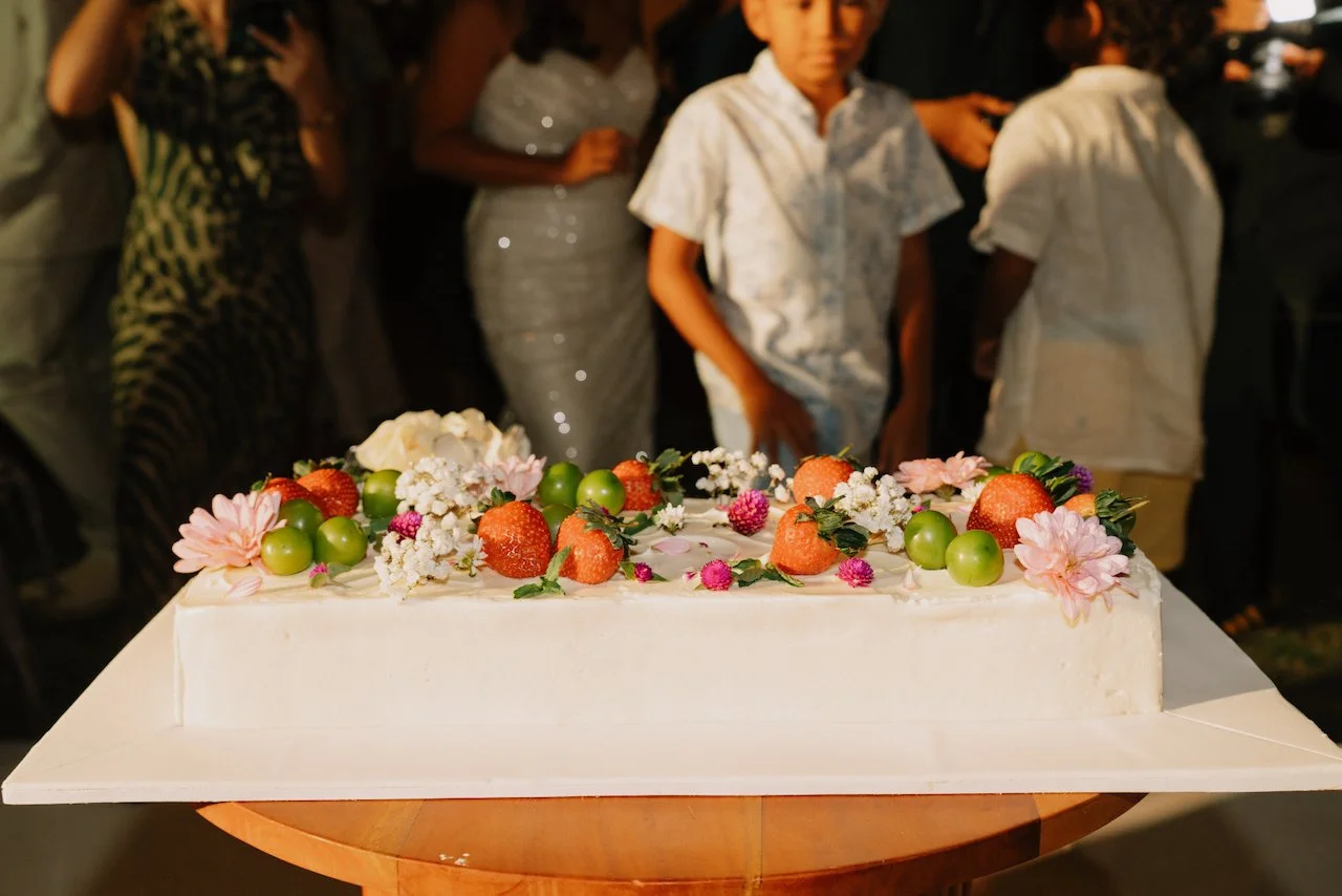 Rectangular vow renewal cake decorated with fresh citrus fruits and flowers
