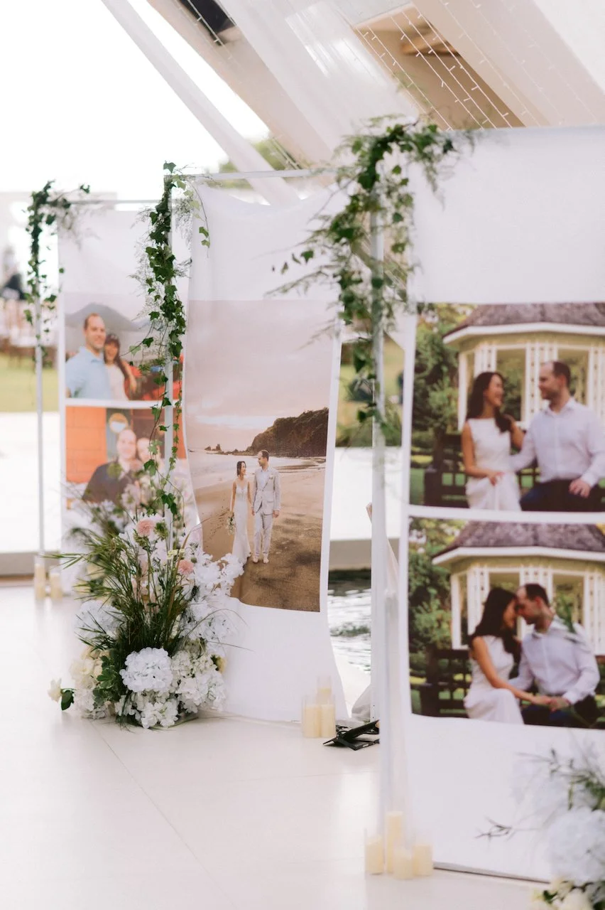 Wedding entrance walkway decorated with large portrait banners of the bride and groom