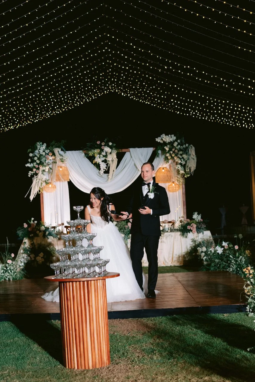champagne tower on a wooden dance floor at night