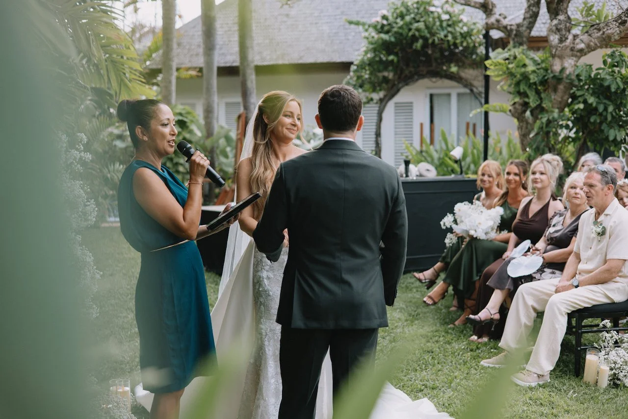 Wedding celebrant speaking during an outdoor ceremony at Puri Nirwana Bali