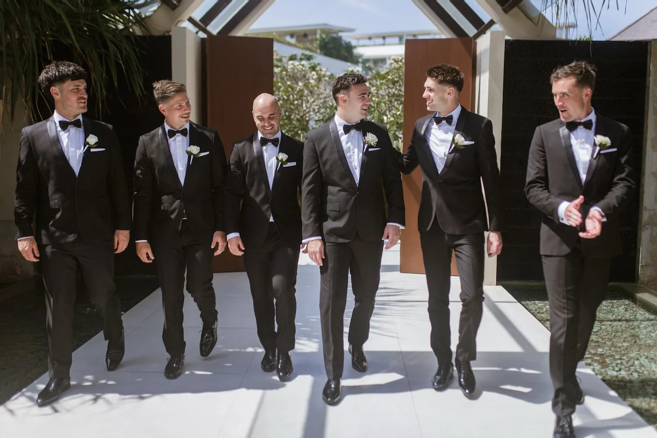 Groomsmen walking together before the wedding ceremony
