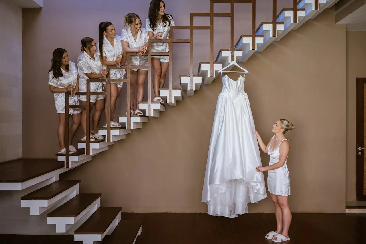 Bride standing on the staircase before her wedding