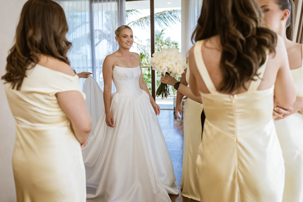 Bride with her bridesmaids before walking down the aisle