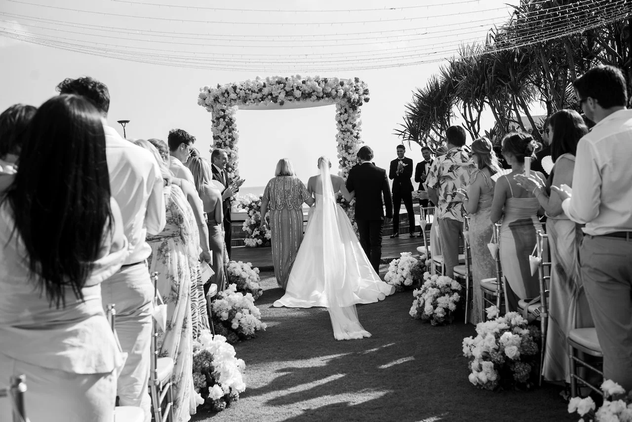 Bride walking down the aisle towards the ceremony