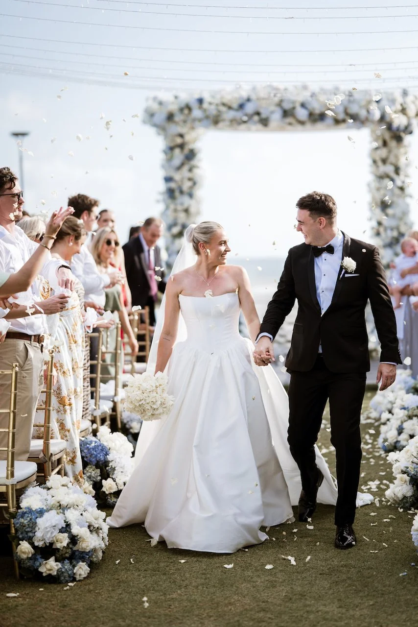 Kelsey and Jason walking together after their ceremony