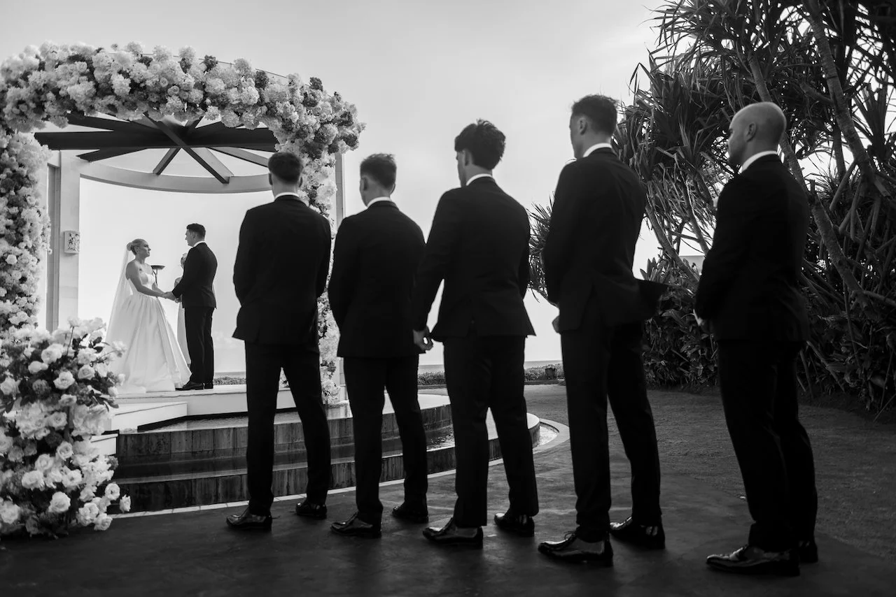 Groomsmen watching the wedding ceremony