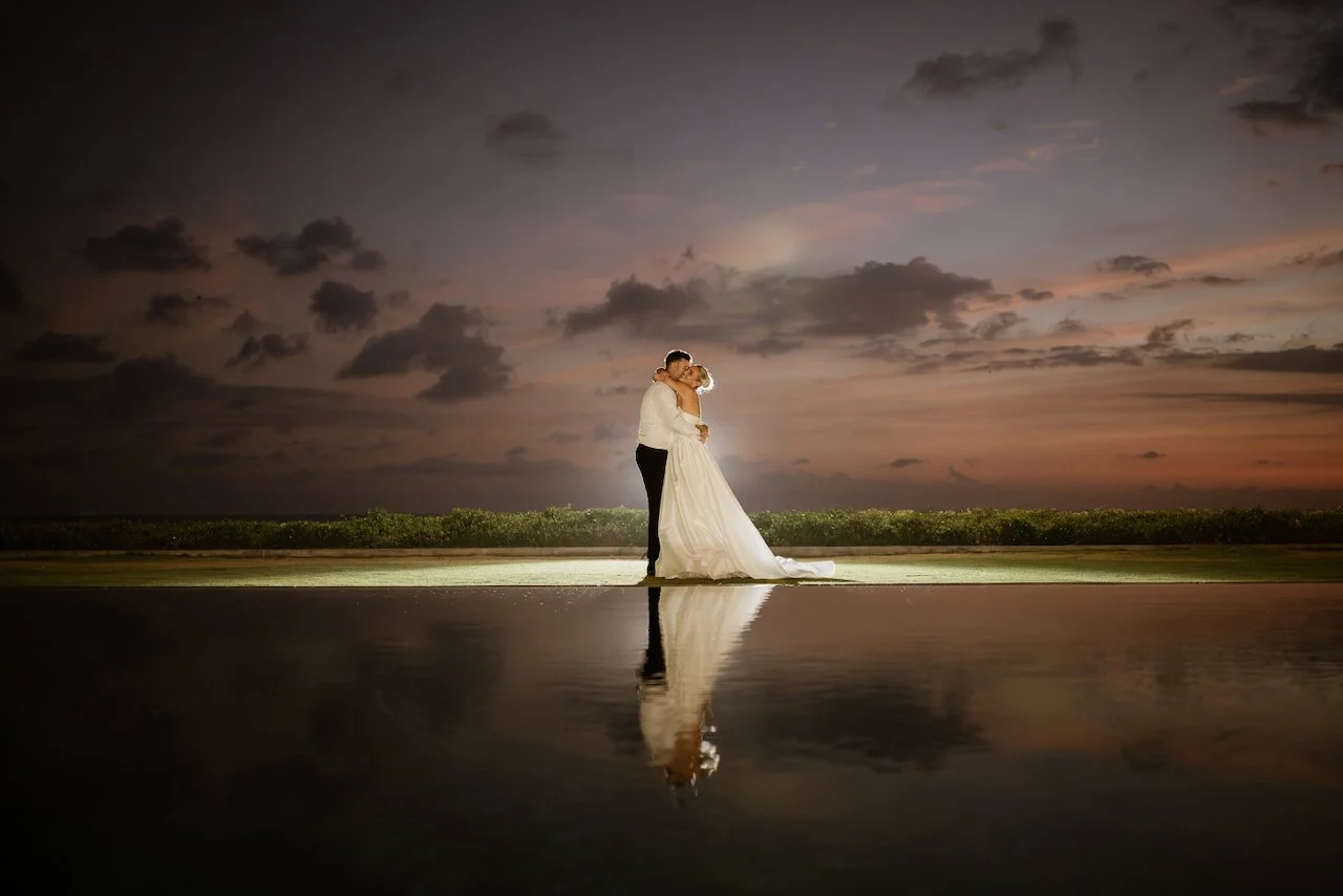 Kelsey and Jason standing together at sunset