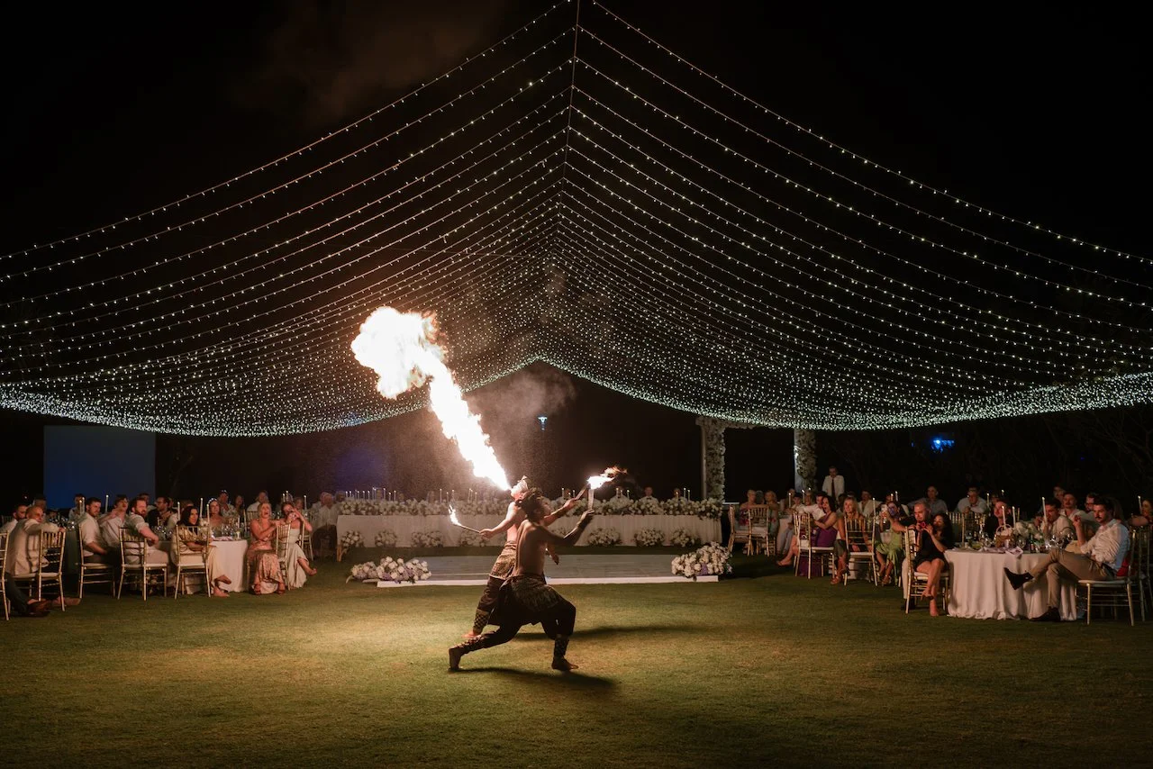 Fire performer entertaining guests at the wedding reception