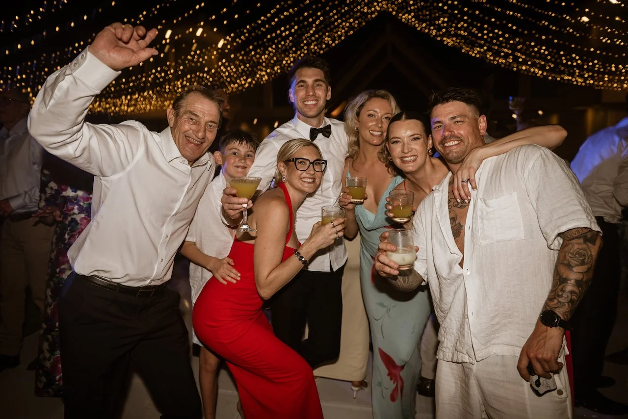Wedding guests posing together during the reception