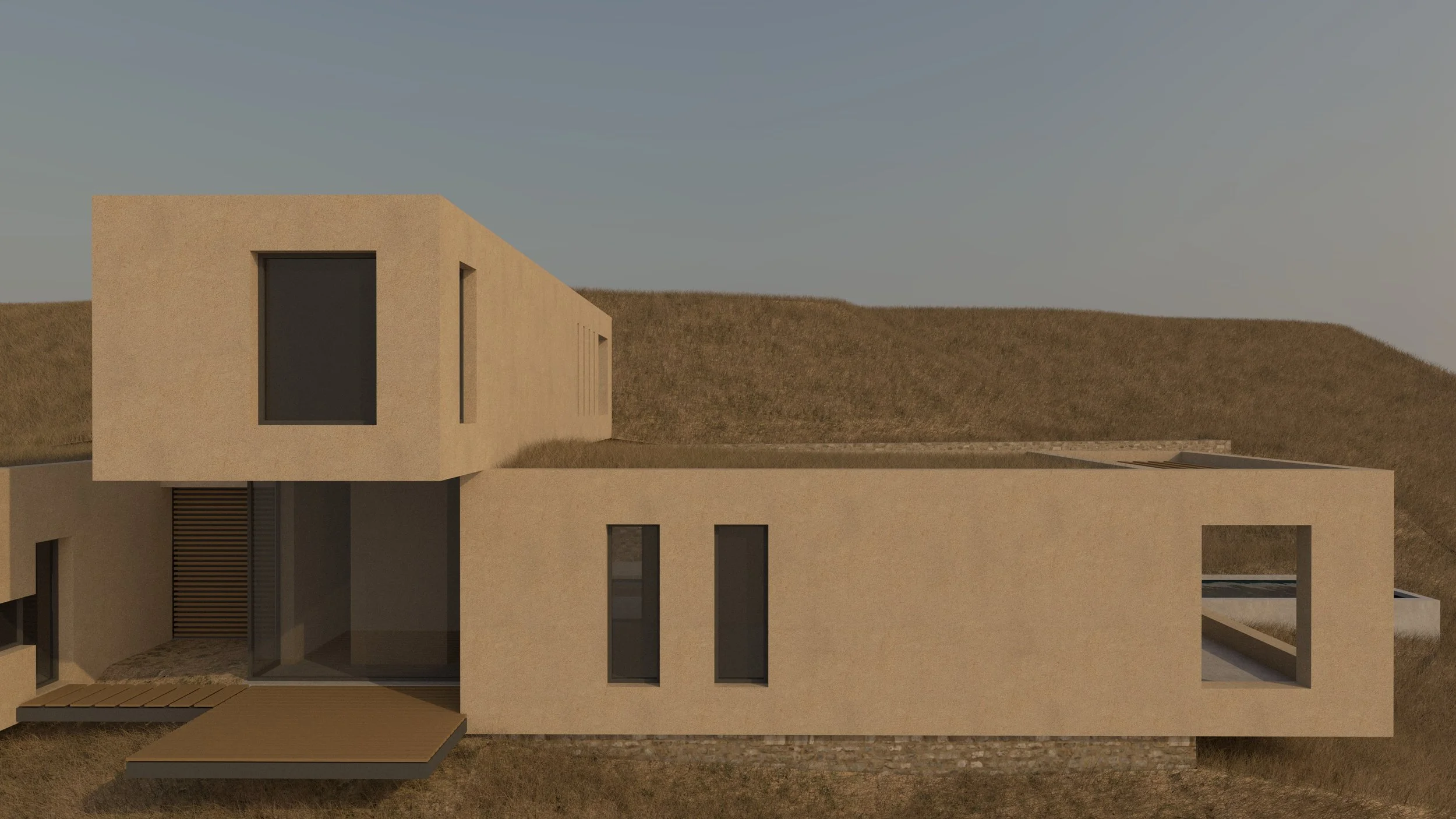 Modern, minimalist house with beige exterior walls, large windows, and flat roof, situated on a grassy hillside.