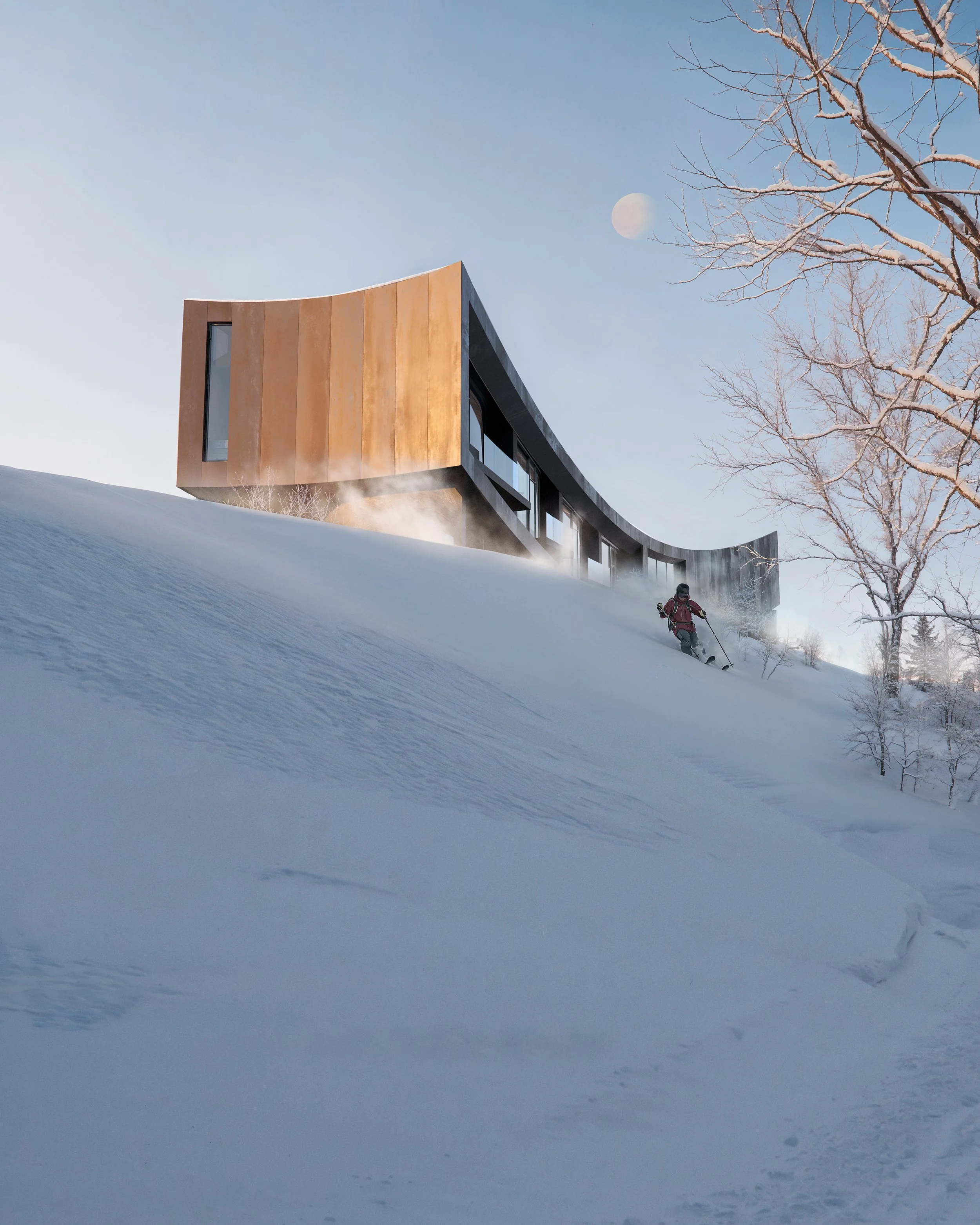 A modern house with wooden and black exterior is situated on a snow-covered hillside. A person skiing down the slope towards the house, with the moon visible in the daytime sky, along with a leafless tree.