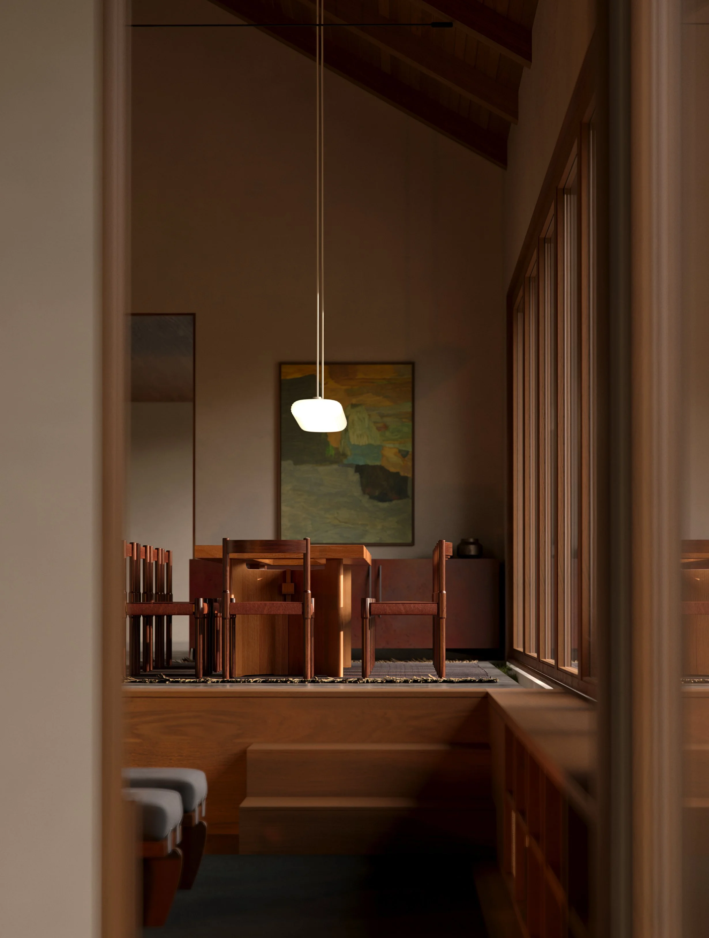 A view through a doorway of a dining room with wooden chairs, a matching wooden dining table, a modern hanging light, a painting on the wall, and a sideboard with decorative items, all in warm wooden tones.