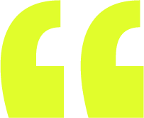 Close-up of stylized yellow quotation marks on a black background.