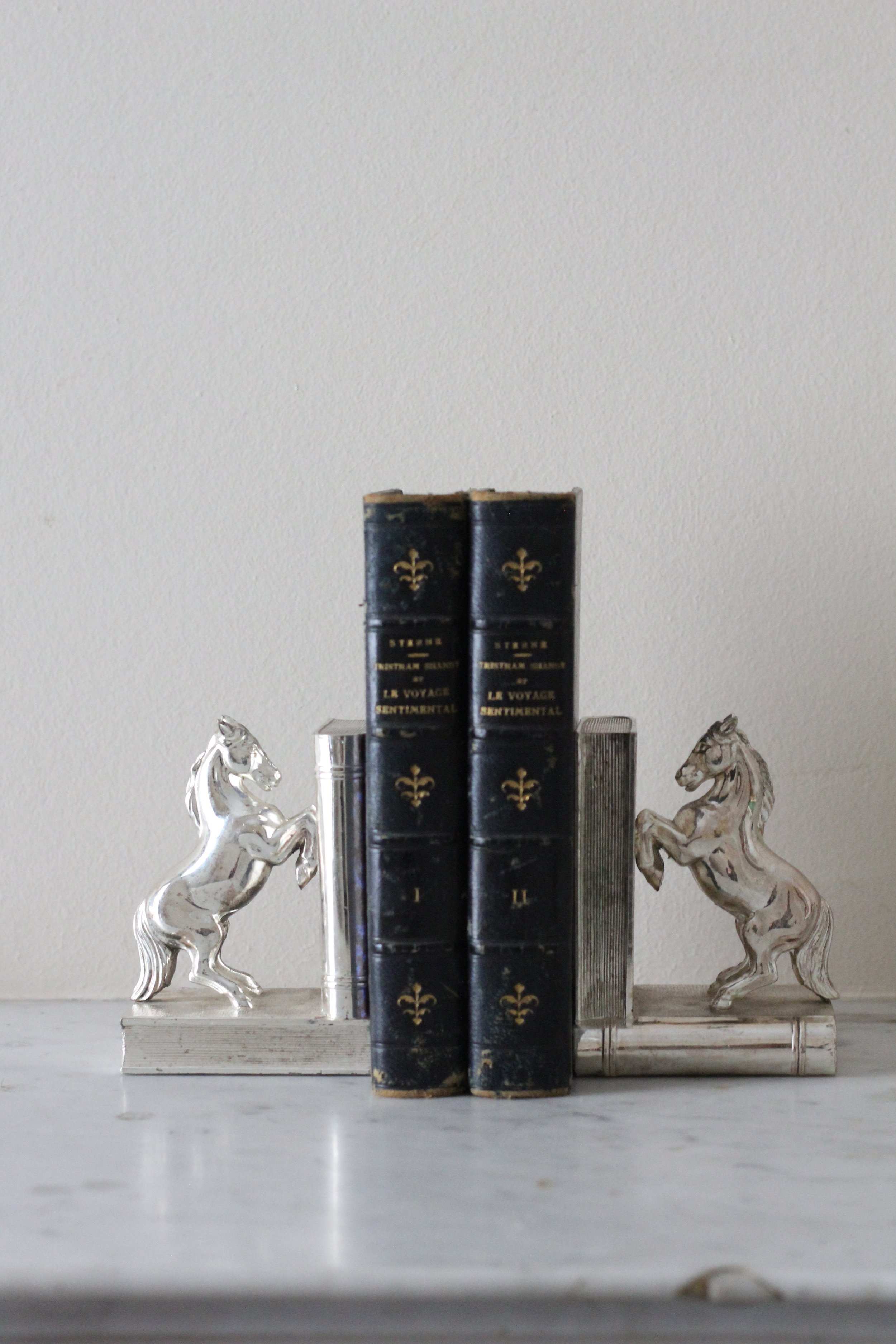 Pair of vintage horse bookends, silver metal