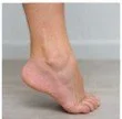 A close-up of a person's detached foot prosthetic on the floor.