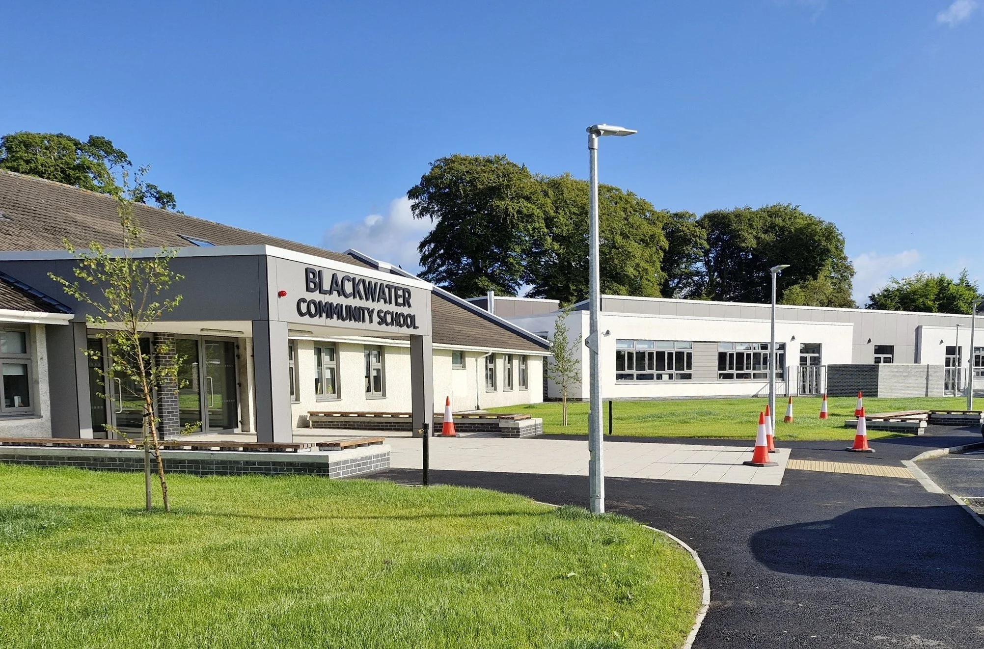 View of Existing Main School Building with new Entrance Canopy and Single Storey 
Extension in the background. (Photo: Butler Moffat Architects)