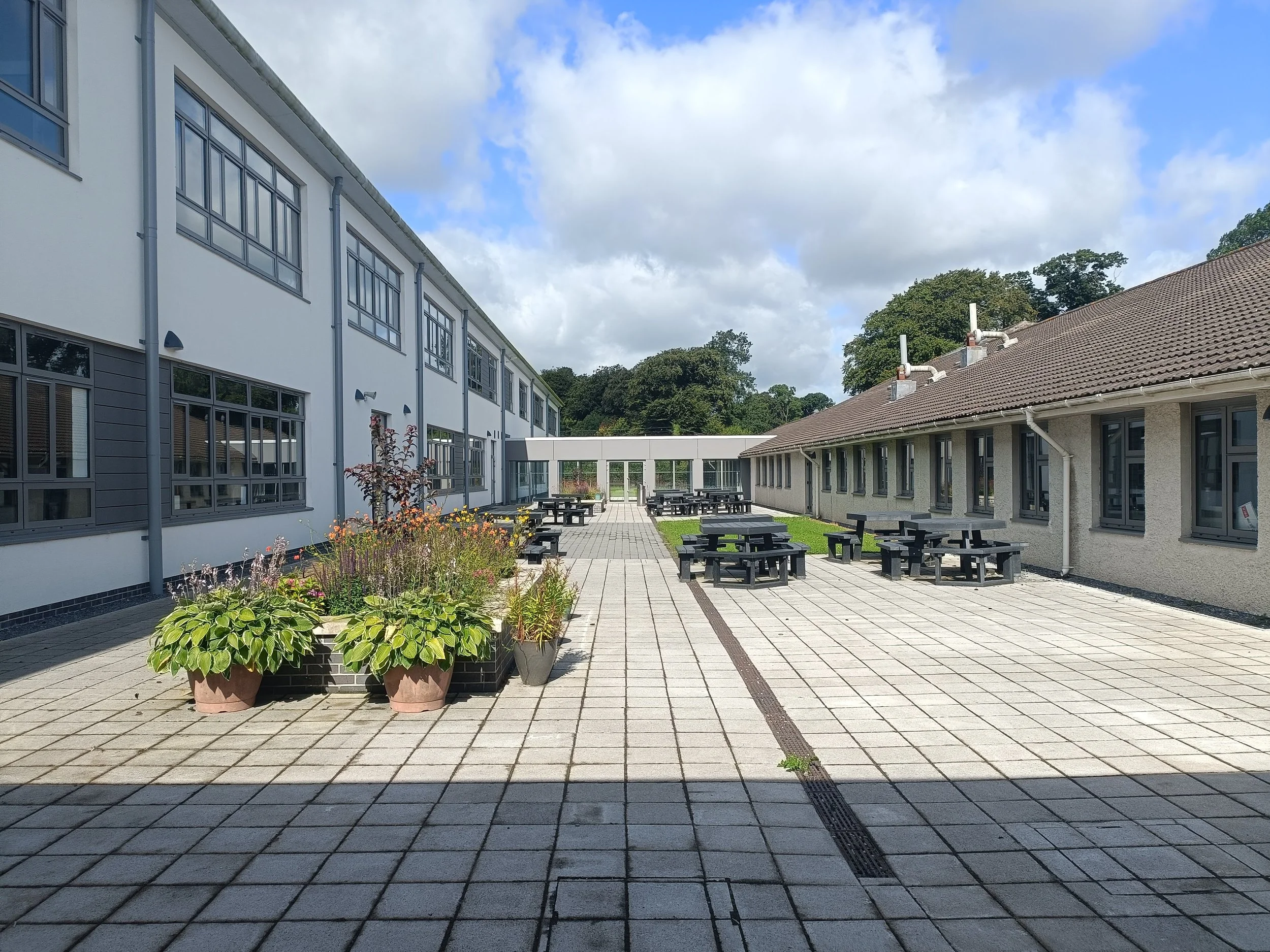 New Courtyard between Existing Main School Building and New 2-storey Extension  
(Photo: Butler Moffat Architects)
