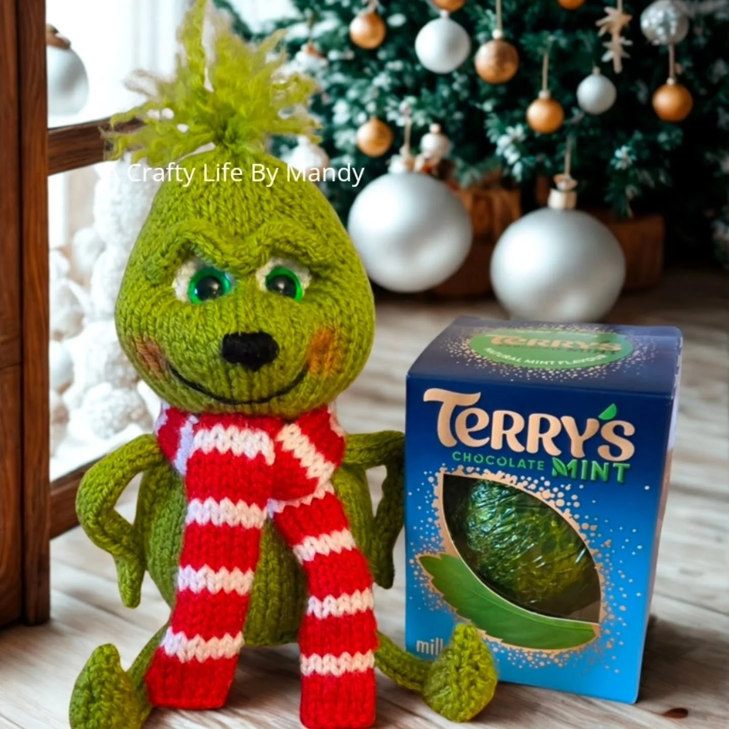 Good afternoon #crafters. Please welcome The Grump into the world of A Crafty Life by Mandy. 

I had soooo much fun with this one. He's my take on The Grinch. Knitted flat on straight needles he can be either a chocolate orange cosy or a softie.

His