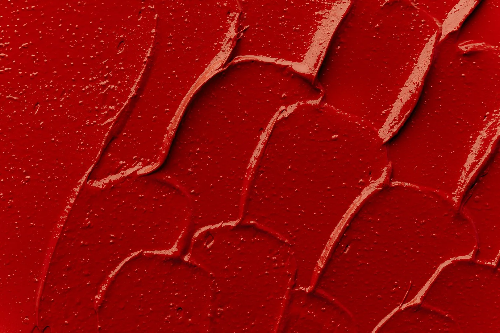 Closeup photo showing smears of red lipstick.