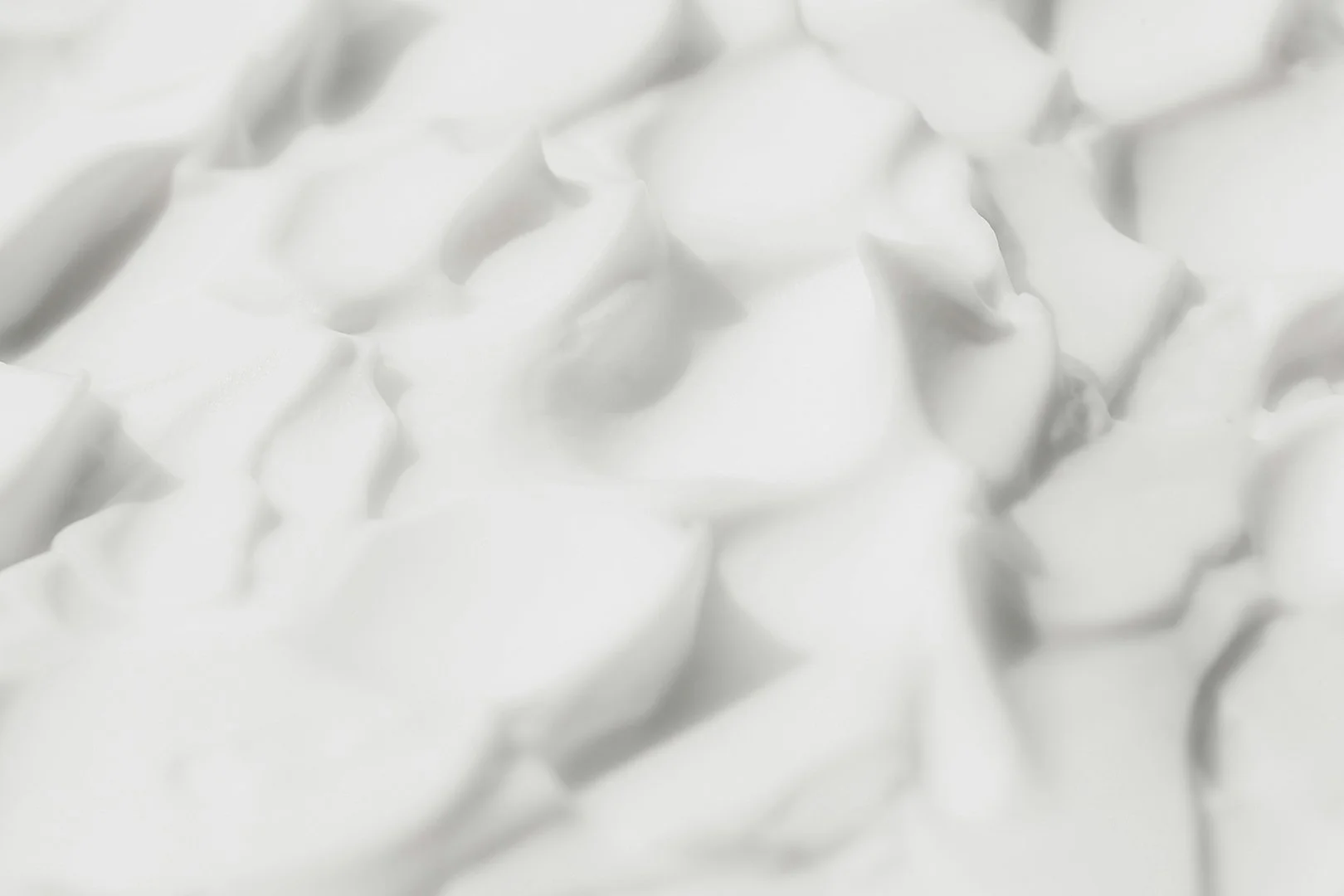 Macro texture of soft white skin cream.