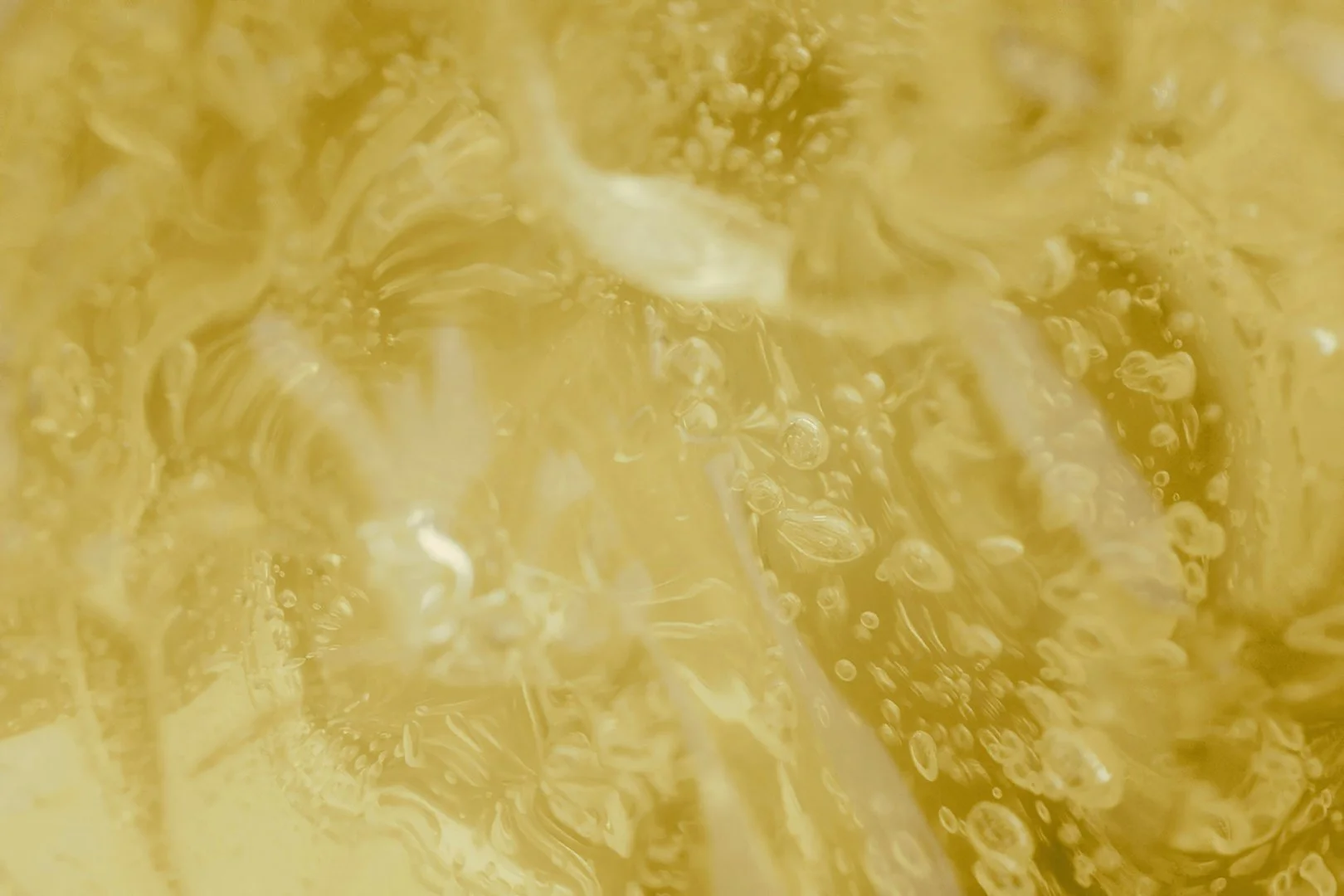 Close up photo of golden yellow honey.