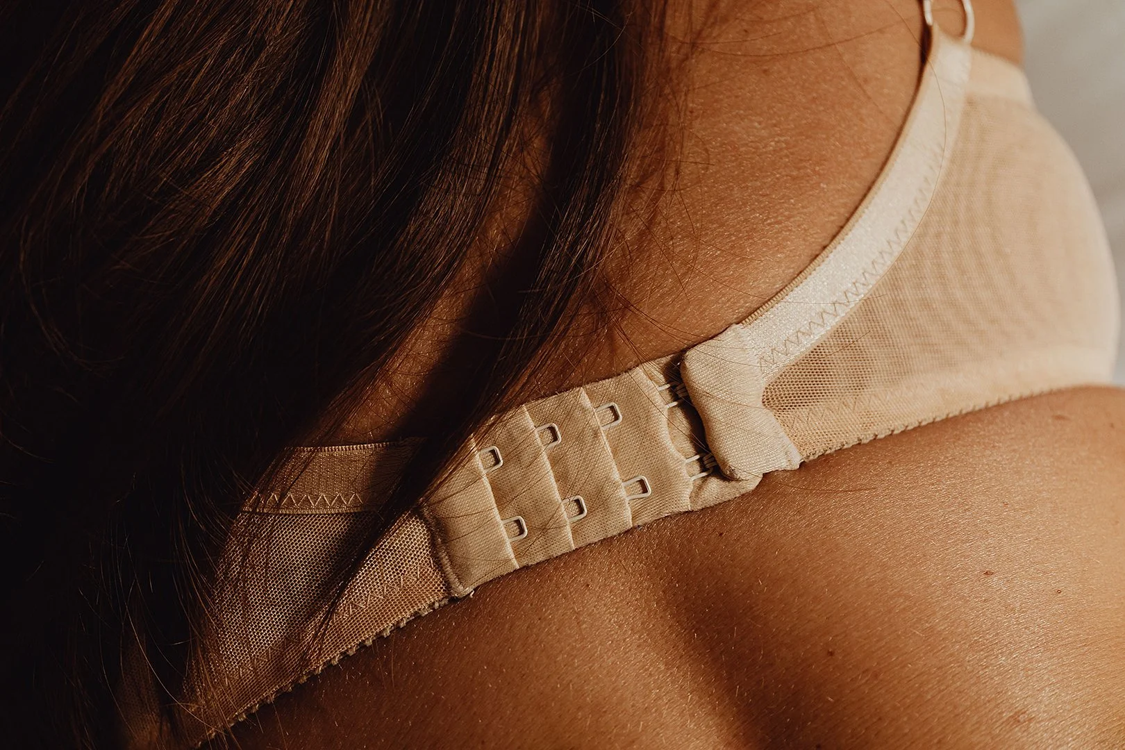 Closeup photo of woman with tanned skin.