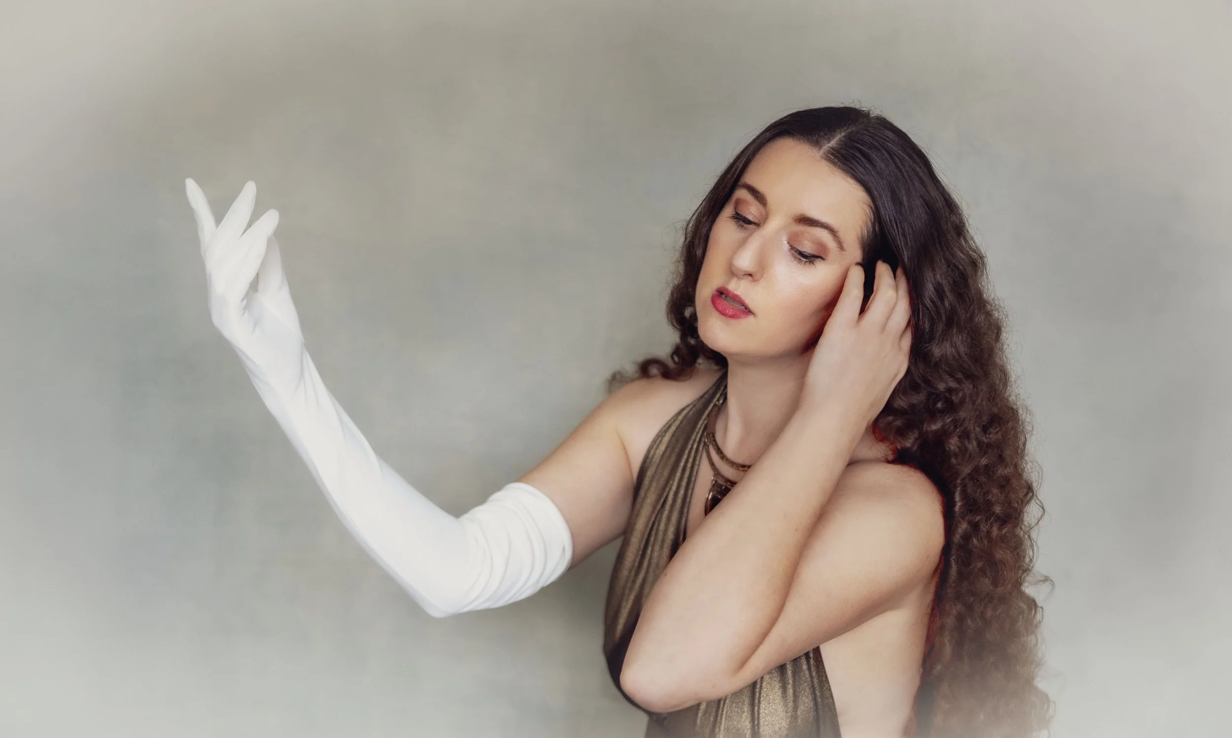 Beautiful woman with long hair posing during a professional glamour photoshoot in the Chicago suburbs