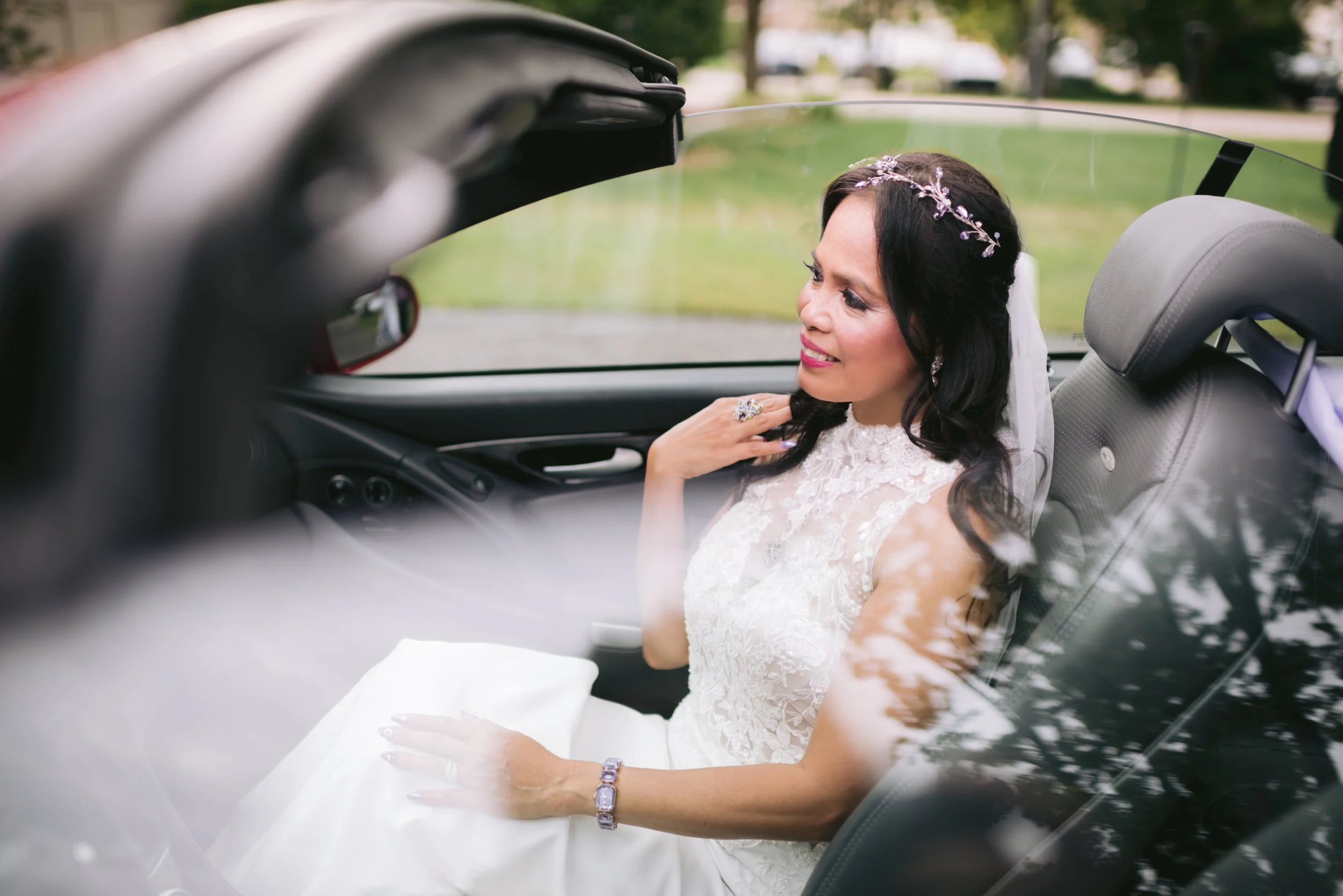 Bride in decorated wedding car