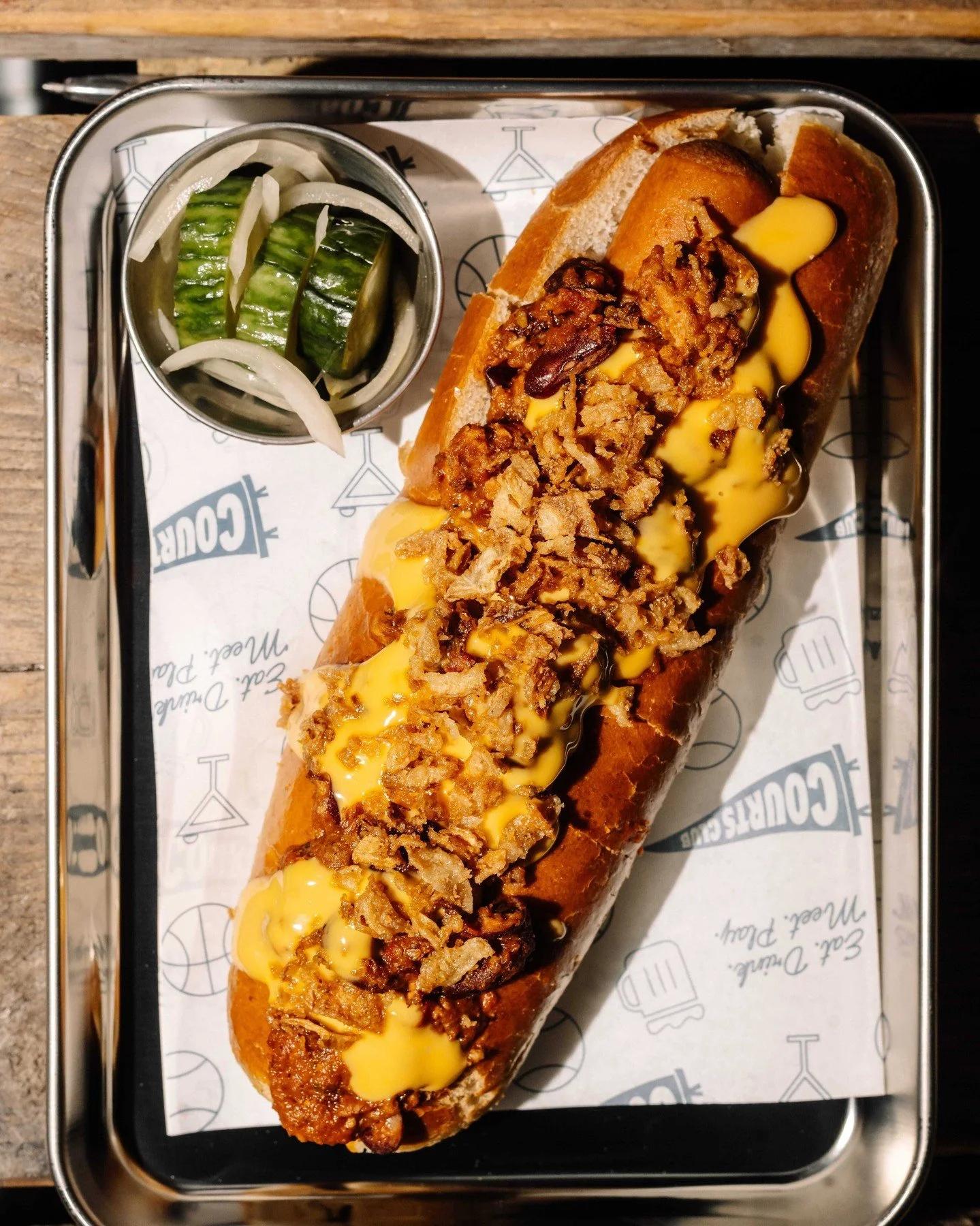 THE CHILLI CHEESE DOG | Topped with next level-chili, american cheese and crispy onions to finish. 

Brand new from The Dugout. Open from 12pm-9pm.