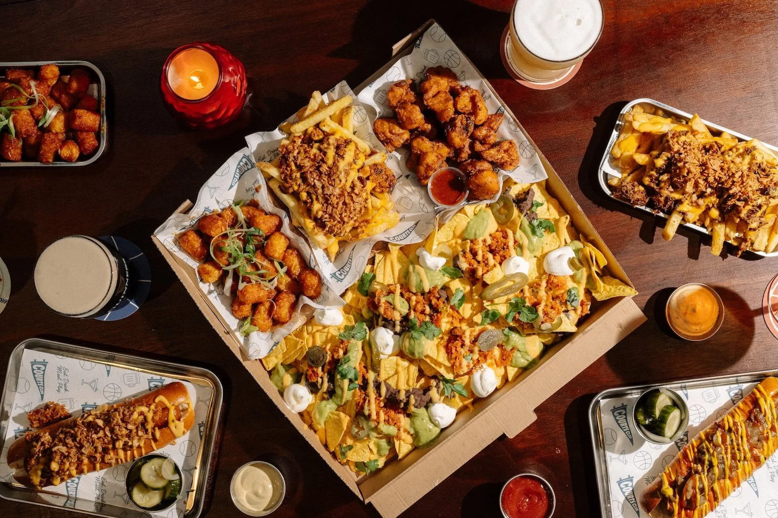 Hotdogs, loaded fries, fried chicken, loaded nachos at The Dugout at Courts Club.